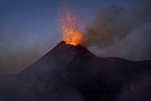 Italy's Mount Etna erupts