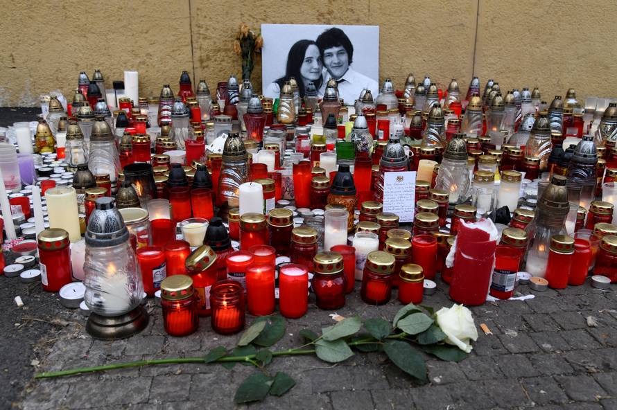 Candles and flowers are left for a tribute to murdered Slovak investigative reporter Jan Kuciak at Slovak National Uprising Square in Bratislava