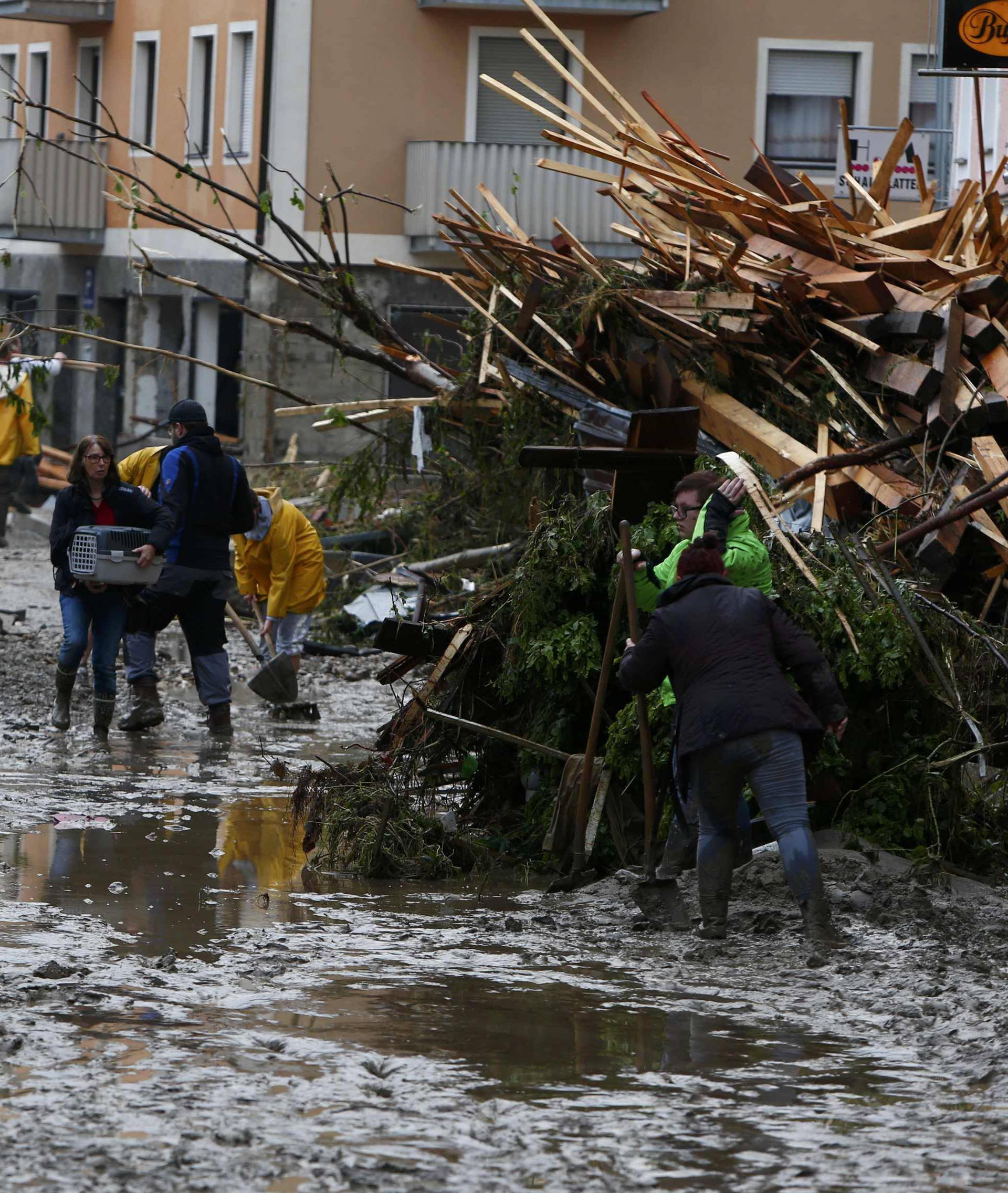 People clear damage in the flooded Bavarian village of Simbach am Inn east of Munich