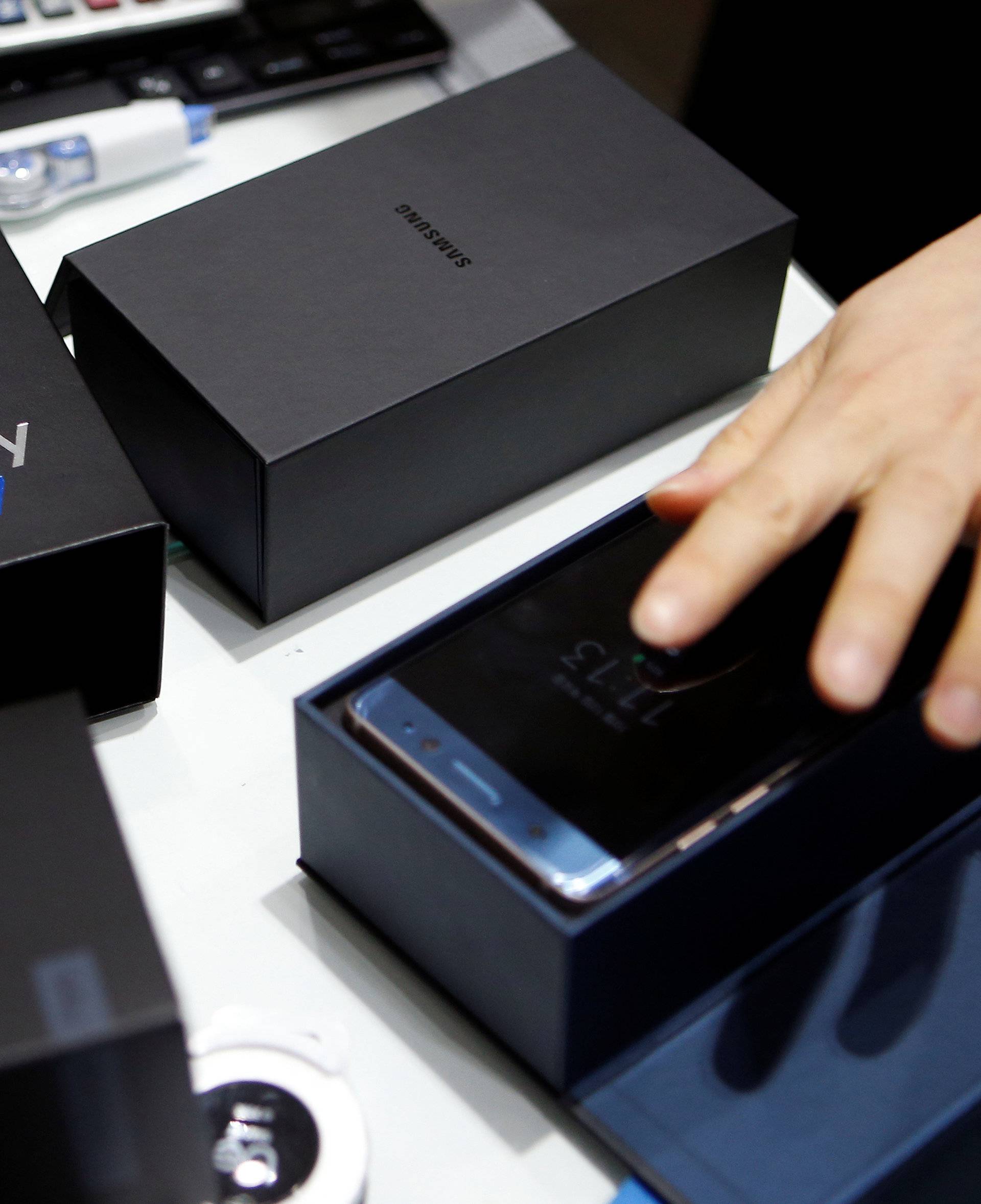 An employee checks exchanged Samsung Electronics' Galaxy Note 7 at company's headquarters in Seoul