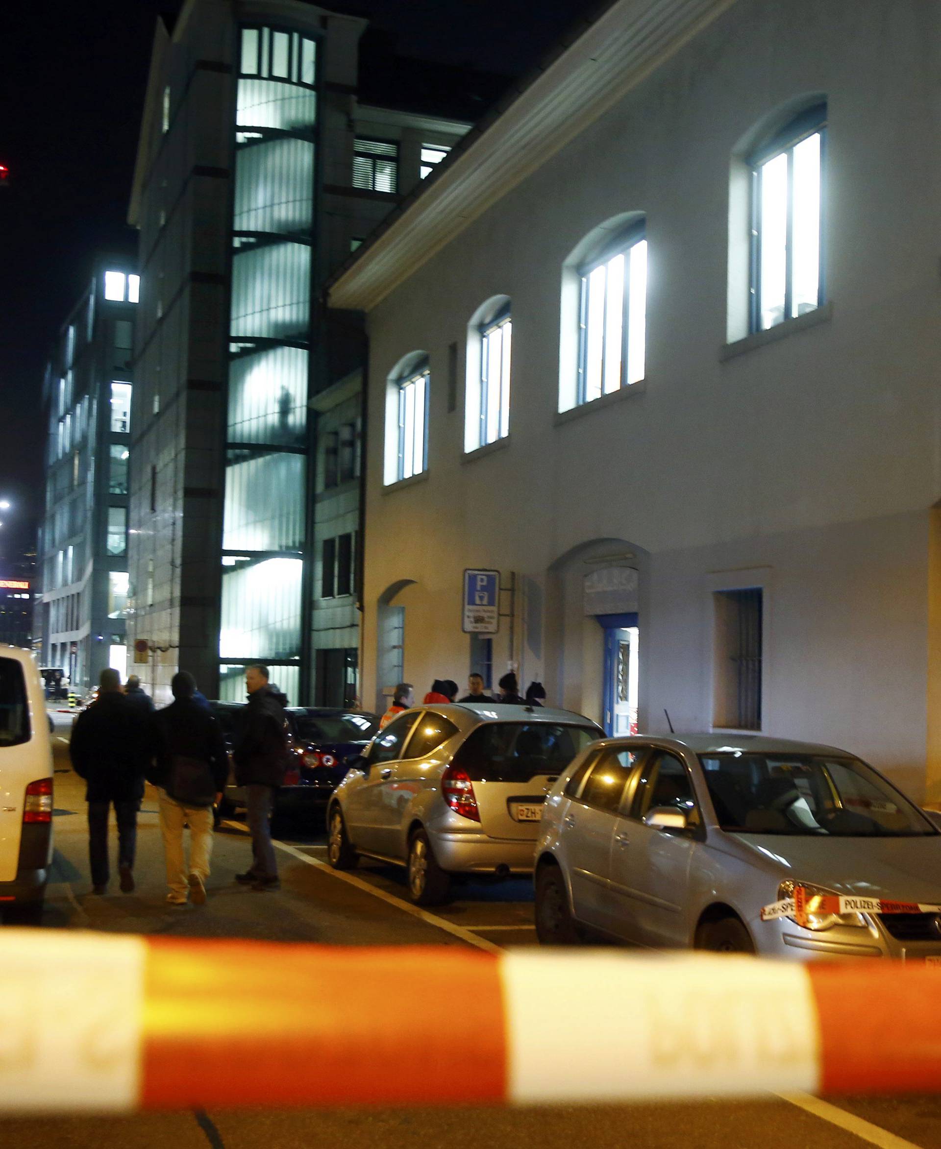 Police stand outside an Islamic center in central Zurich