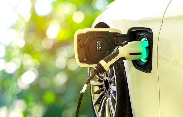 Ev,Car,Or,Electric,Car,At,Charging,Station,With,The