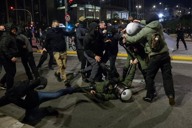 Protesters clash with police during a demonstration after a train crash near the city of Larissa, in Athens