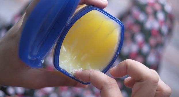 top view of young women use Vaseline for caring health 