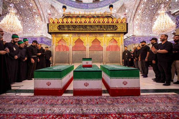 Mourners carry the coffins of family members of Iran’s late Supreme Leader Ayatollah Ali Khamenei, inside the shrine of Imam Abbas during funeral ceremonies in Karbala