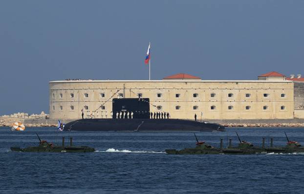 FILE PHOTO: Russian sailors line up on board the diesel-electric submarine "Novorossiysk" during the Navy Day parade in Sevastopol