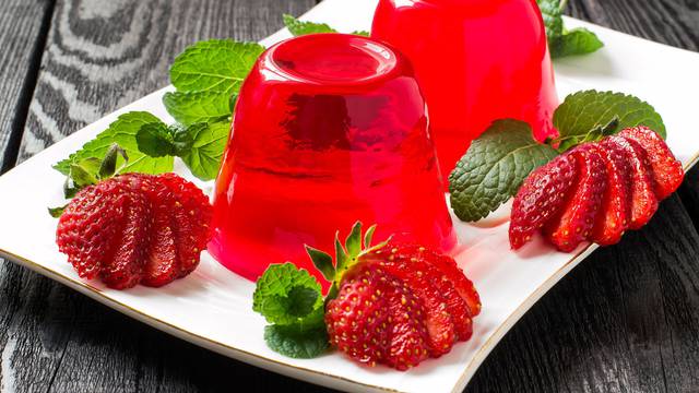Strawberry jelly and ripe strawberries 