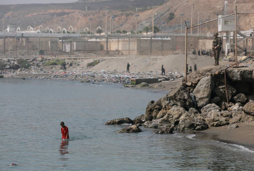 Mass crossings of migrants on foot and by sea from Morocco into Spanish territory, in Ceuta