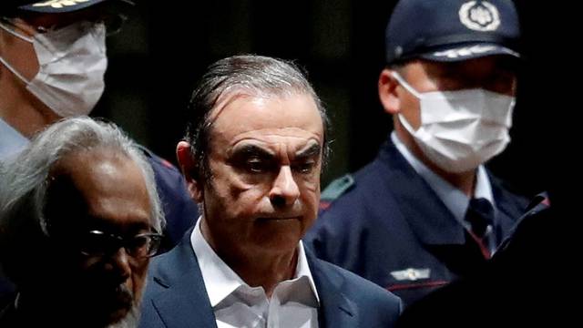 FILE PHOTO: Former Nissan Motor Chariman Carlos Ghosn leaves the Tokyo Detention House