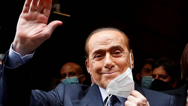FILE PHOTO: Berlusconi arrives at Montecitorio Palace for talks on forming a new government, in Rome