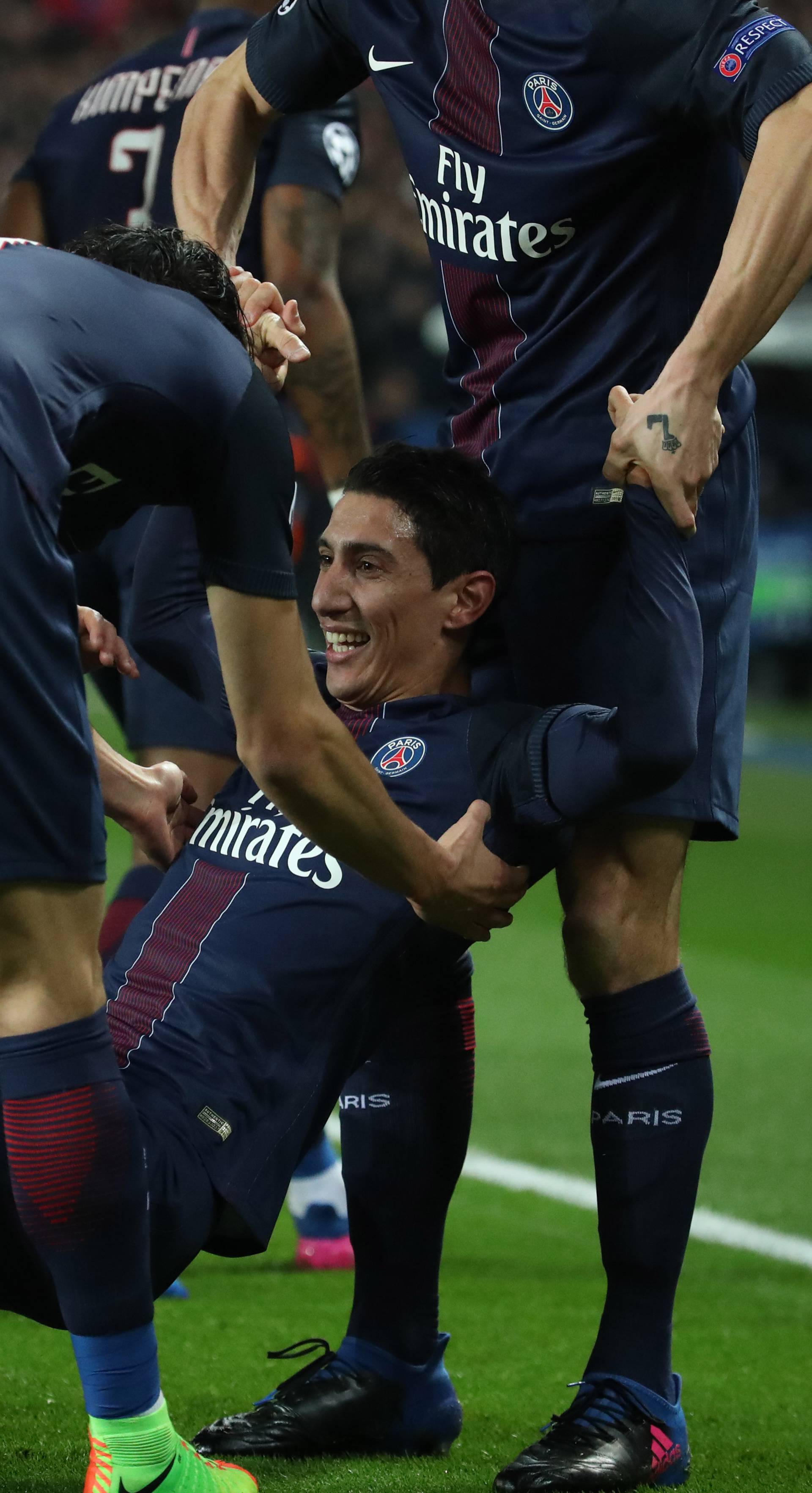 Paris Saint-Germain's Angel Di Maria celebrates scoring their first goal with teammates