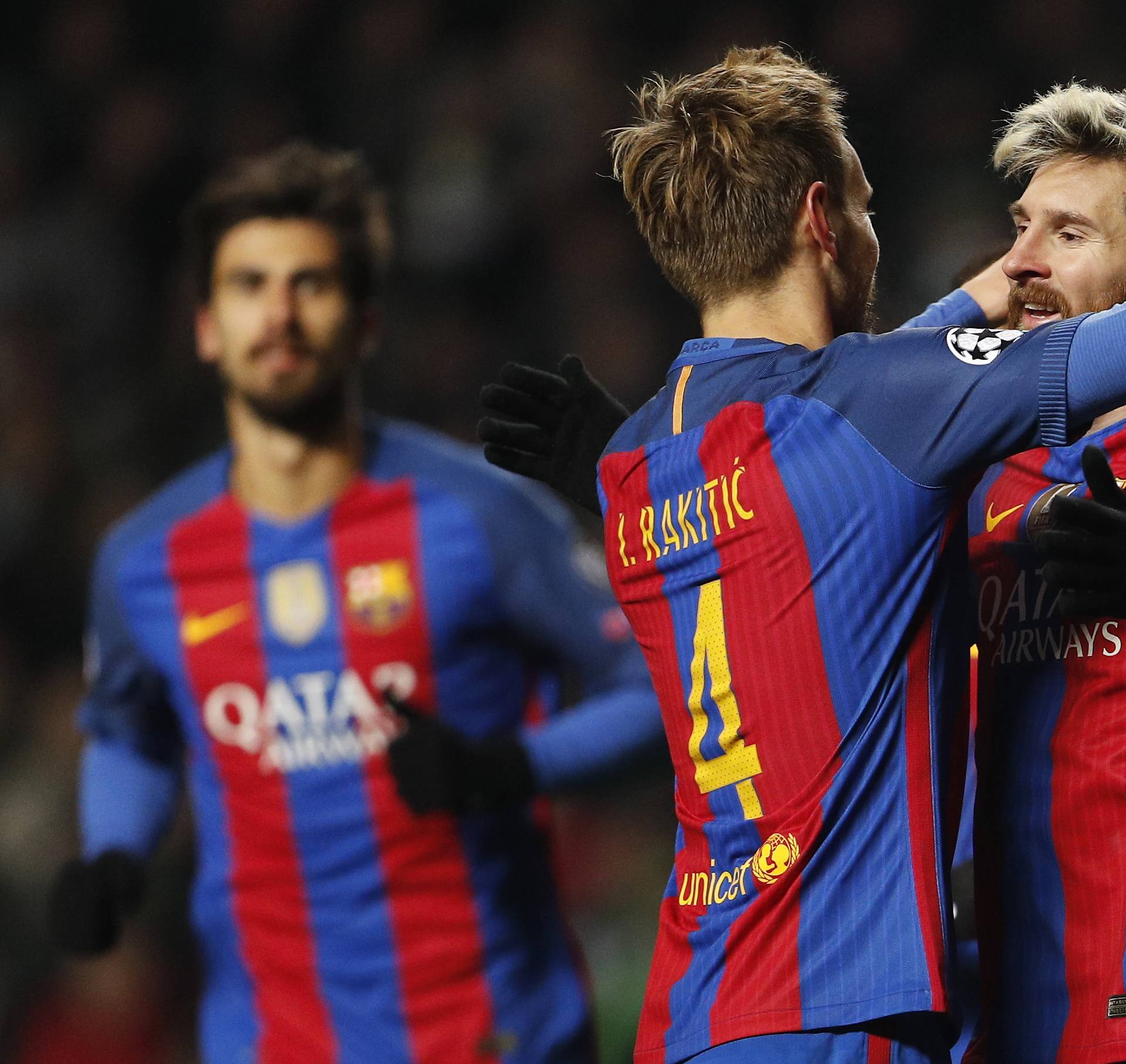 Barcelona's Luis Suarez celebrates scoring their second goal with Ivan Rakitic
