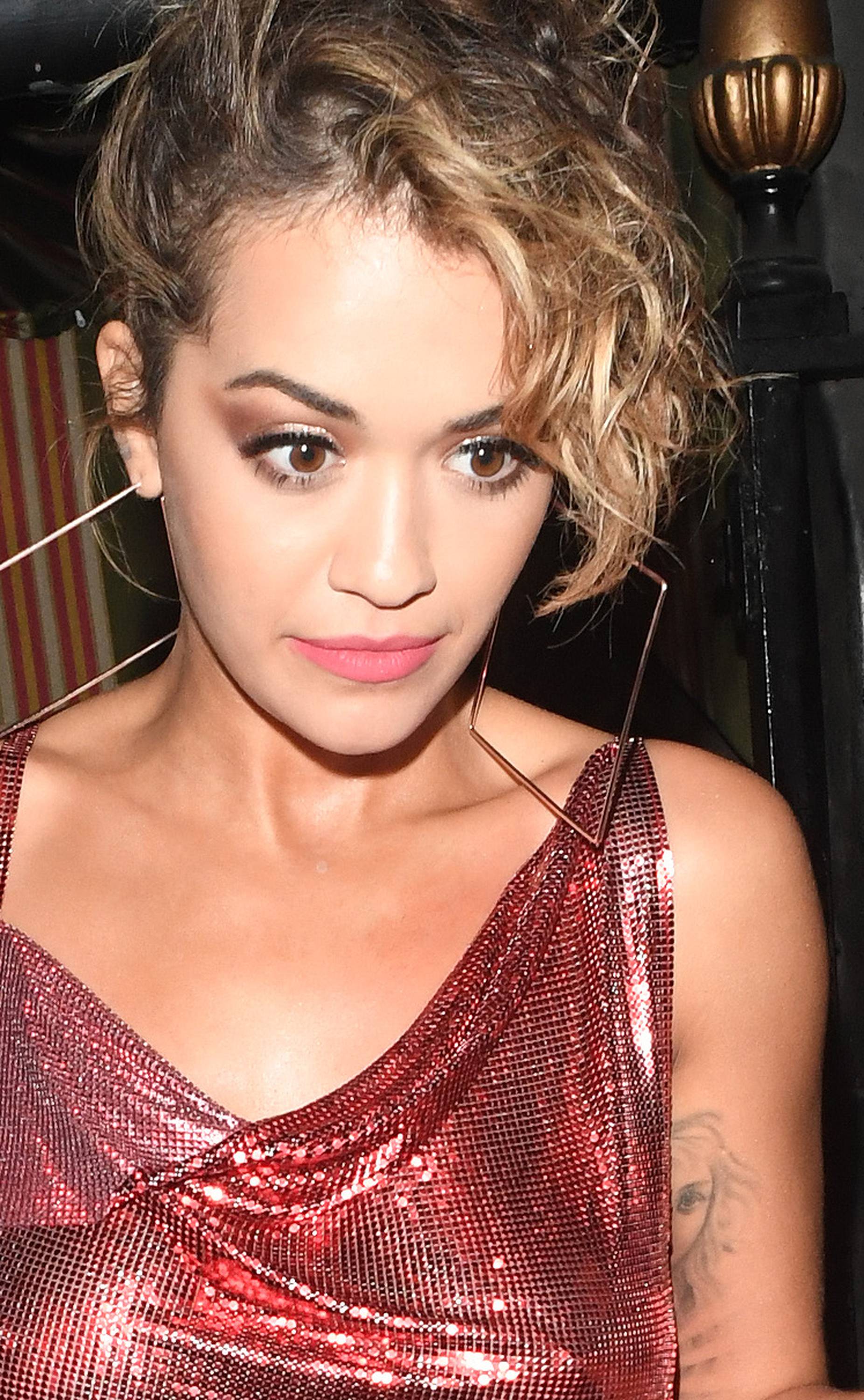 Rita Ora seen leaving Annabells nightclub in London after performing her secret gig. Rita was seen being helped to her car by security as she looked a little blurry eyed.