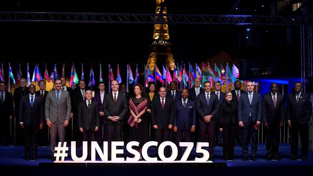 International leaders pose for a family picture during the 75th anniversary celebrations of The United Nations Educational, Scientific and Cultural Organization (UNESCO) in Paris