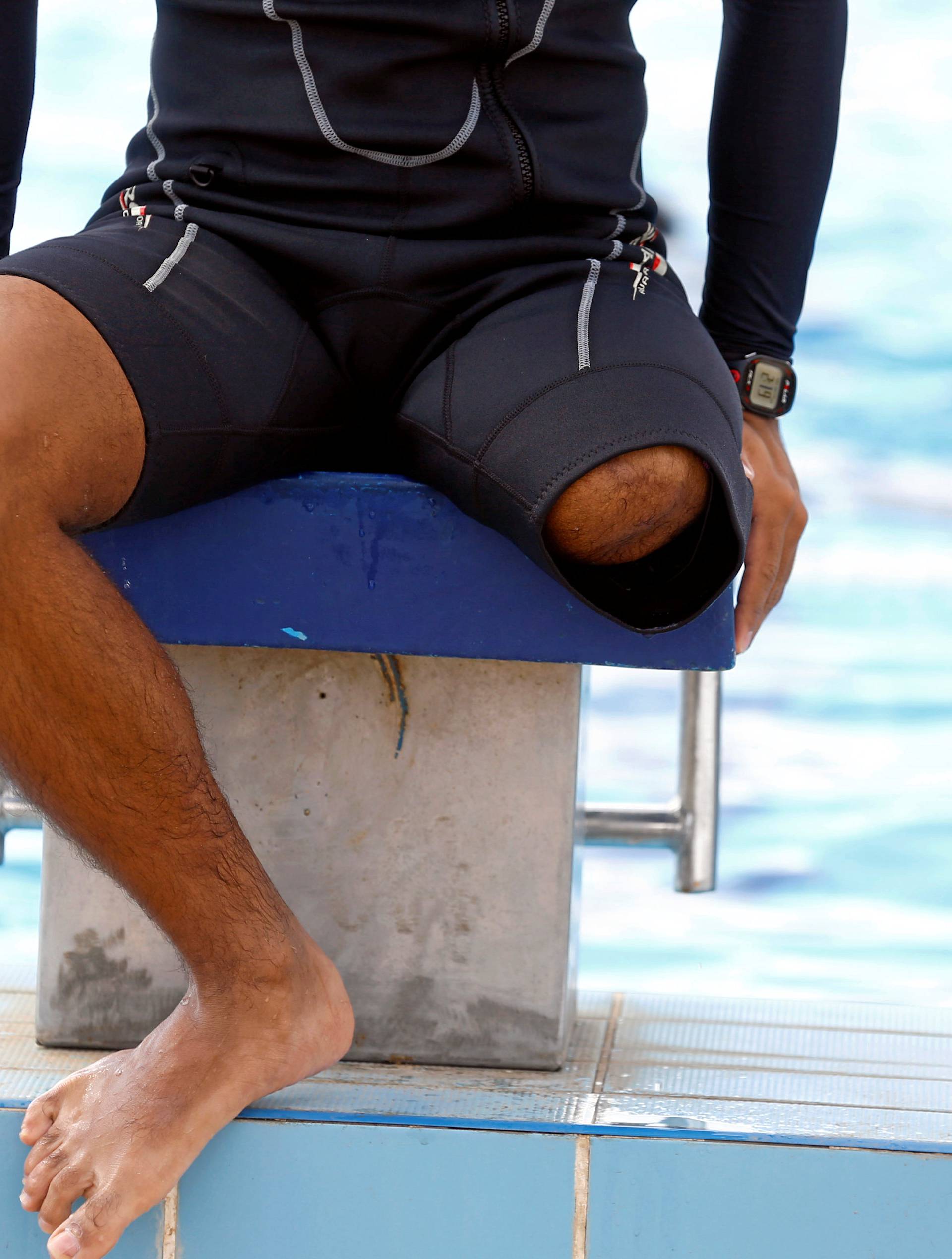 Egyptian swimmer Omar Hegazy, who is the first one-legged man to swim across the Gulf of Aqaba from Egypt to Jordan, rests after practice in Cairo