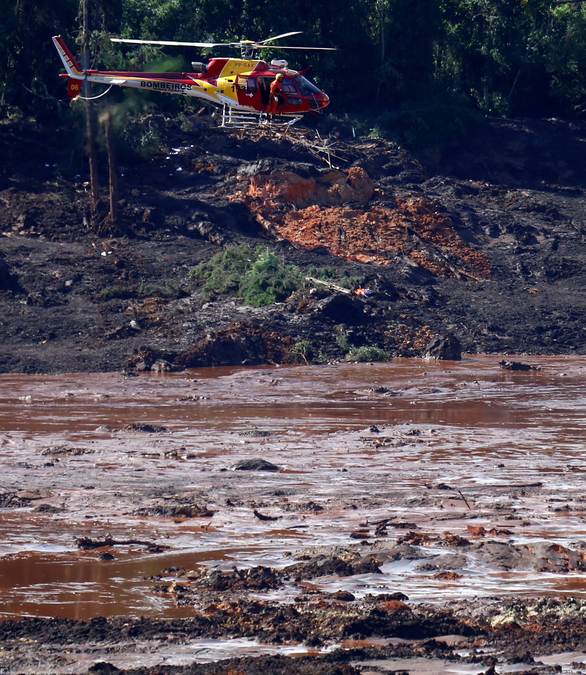 A rescue helicopter searches for victims after a tailings dam owned by Brazilian miner Vale SA burst, in Brumadinho