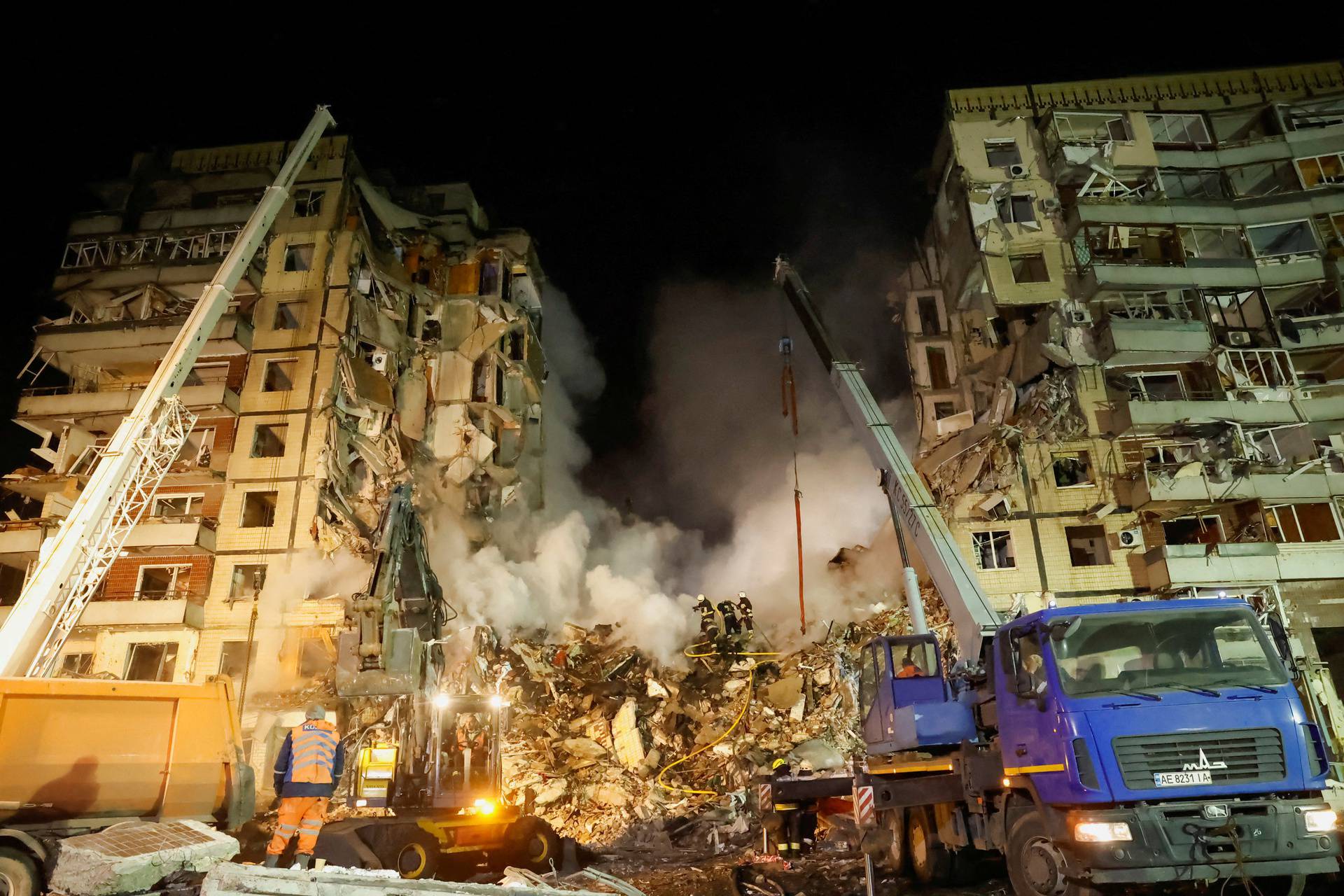 Aftermath of Dnipro apartment block destruction following missile strike