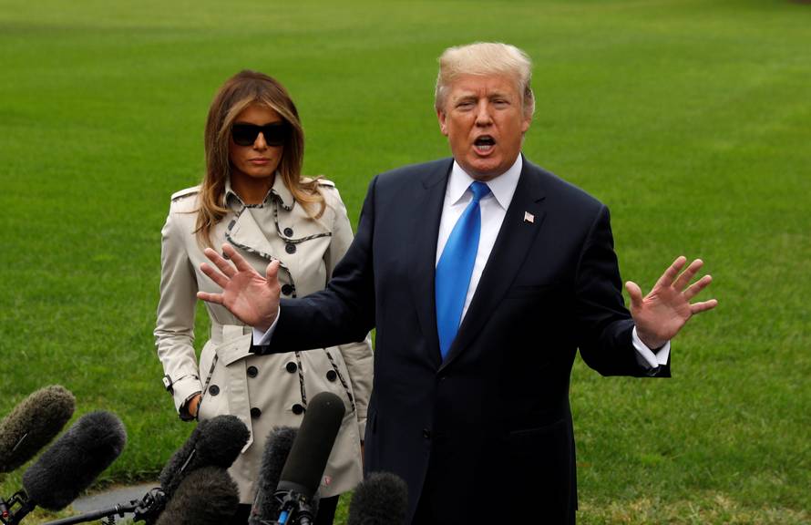 Trump speaks to reporters as he leaves the White House in Washington