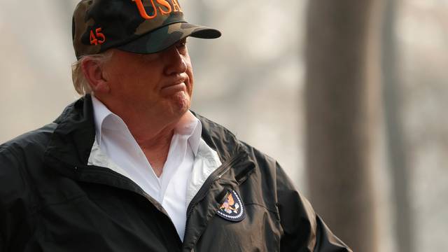 U.S. President Donald Trump visits a neighborhood recently destroyed by the Camp Fire in Paradise, California, U.S.
