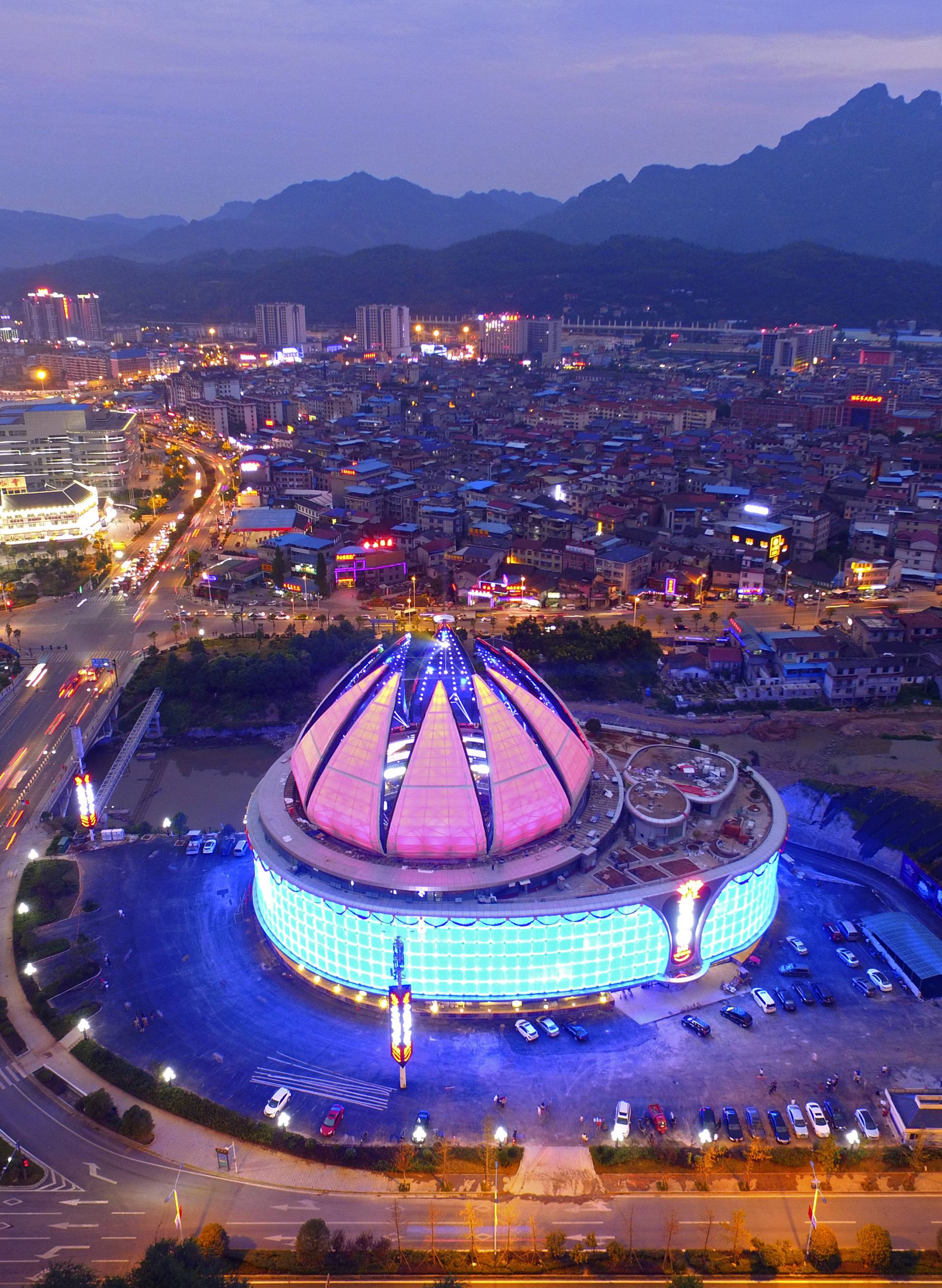 World's largest transparent-domed bar with a lotus-shaped retractable dome is seen in Zhangjiajie