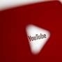 FILE PHOTO:    A 3D-printed YouTube icon is seen in front of a displayed YouTube logo in this illustration