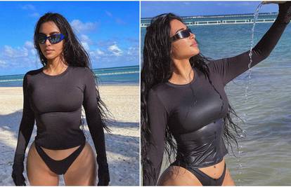 Kim se na plaži hladila vodom, svi gledali u njene bujne obline