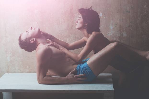 young couple of muscular macho man and pretty sexy woman