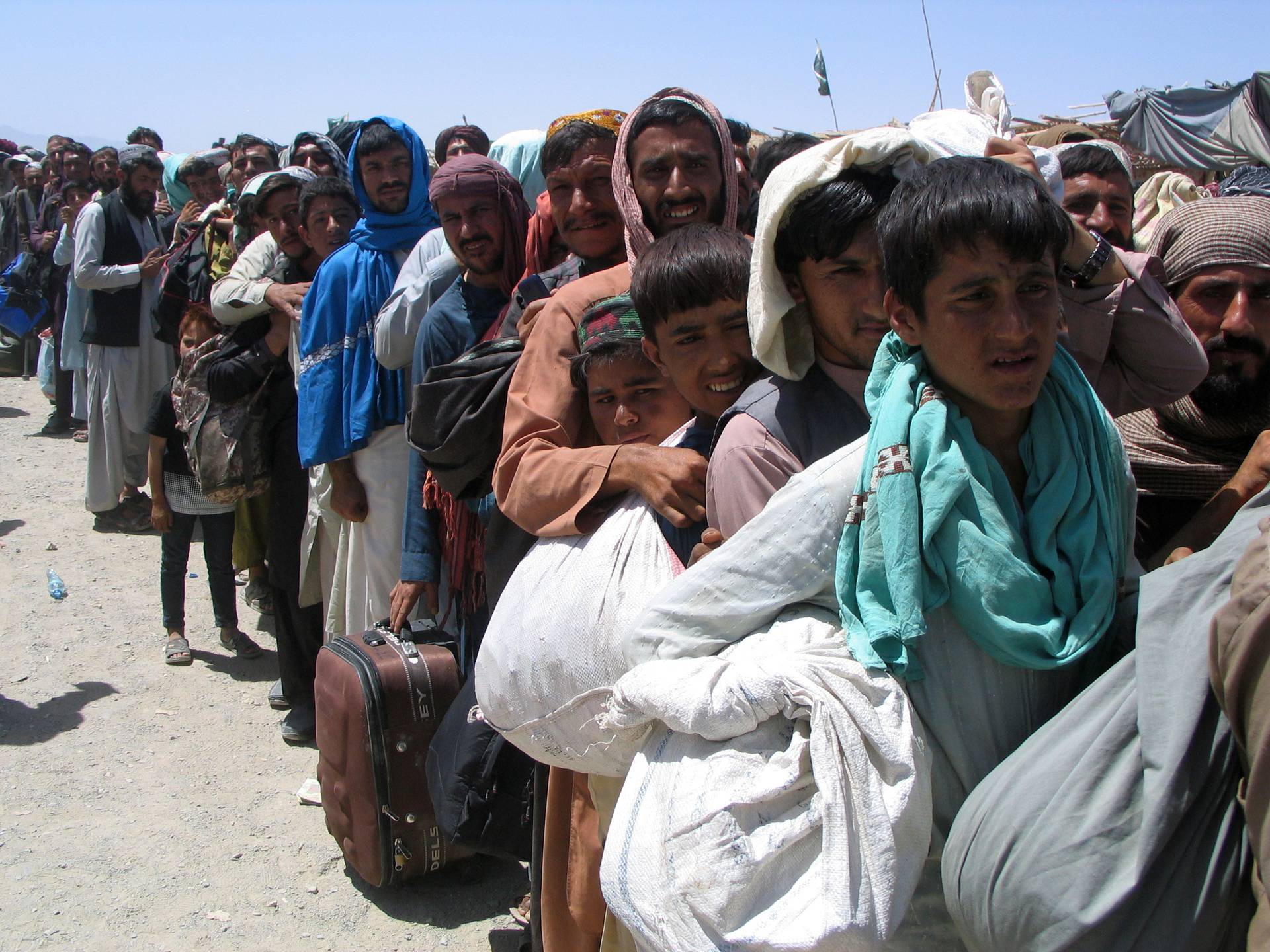 People wait to cross at Friendship Gate at Pakistan-Afghanistan border town of Chaman