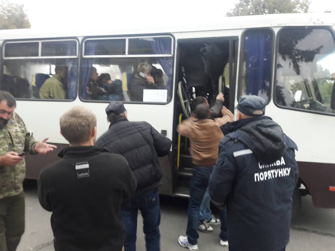 Emergency workers evacuate local residents after a fire and explosions hit the Ukrainian defence ministry ammunition depot in the eastern Chernigov region, in the settlement of Druzhba