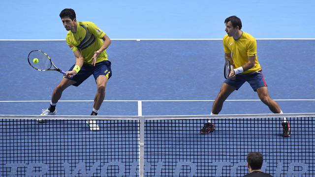 Great Britain's Jamie Murray (bottom) during his doubles match with Brazil's Bruno Soares against Croatia's Ivan Dodig and Brazil's Marcelo Melo