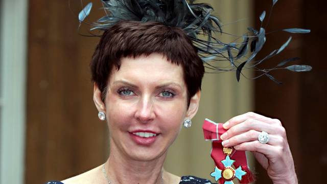FILE PHOTO: bet365 Chief Executive Denise Coates poses with her CBE medal after being knighted by Britain's Prince Charles at Buckingham Palace in London