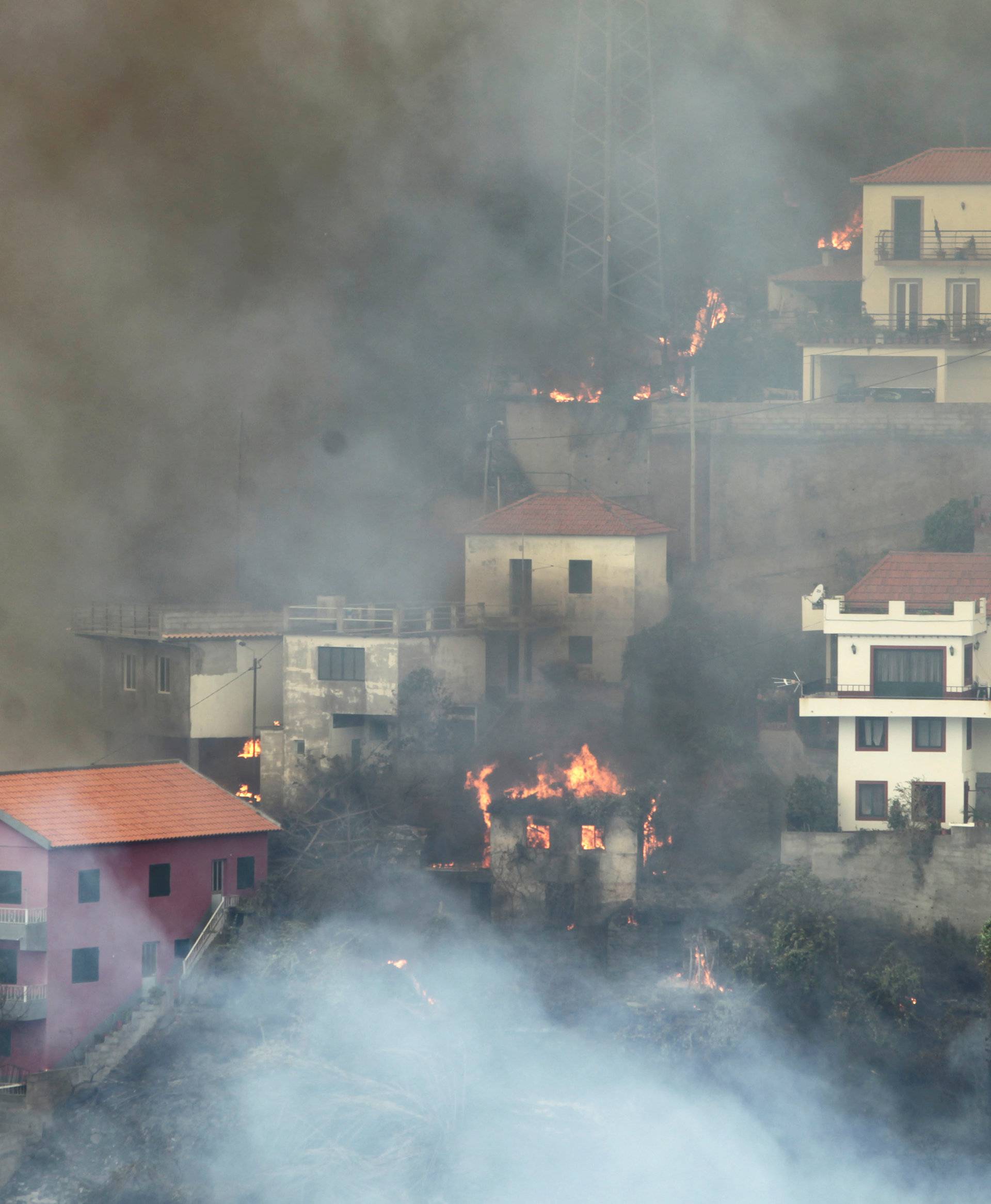 View of Sitio de Curral dos Romeiros during the wildfires at Funchal, Madeira island