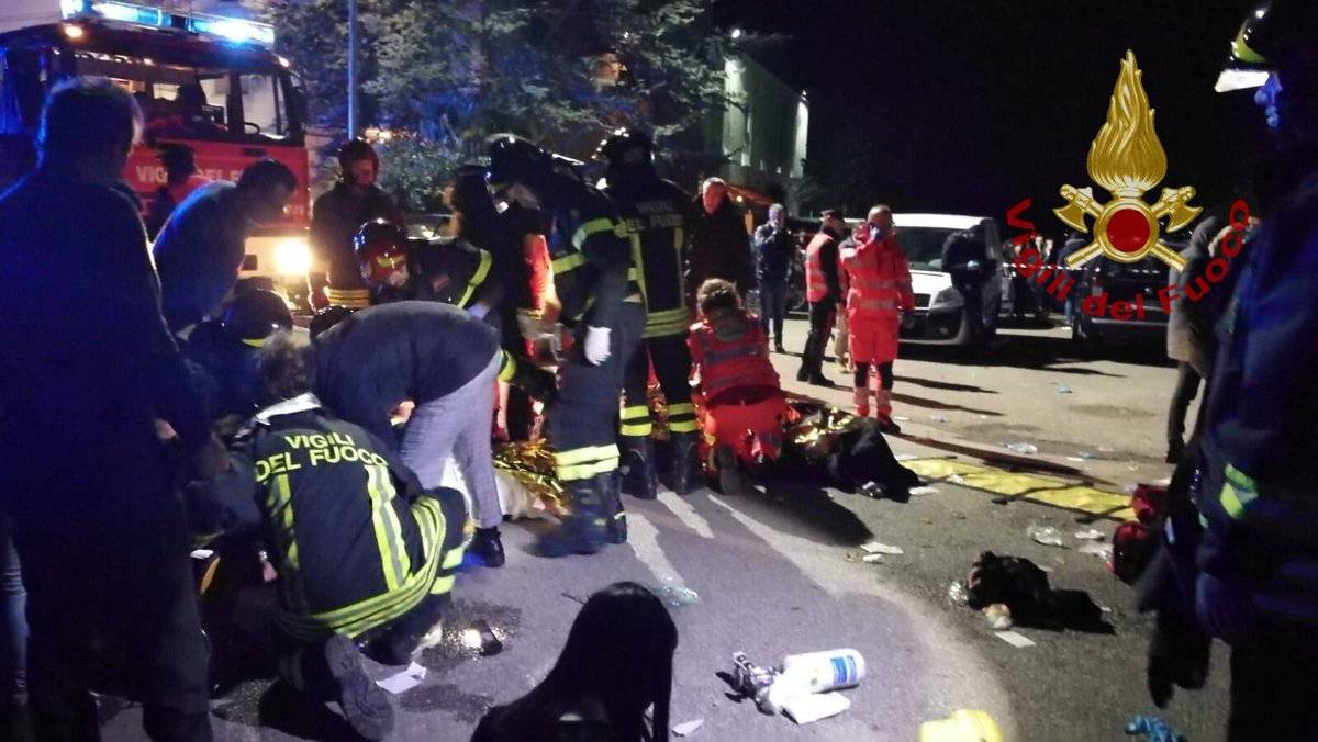 Emergency personnel attend to victims of a stampede at a nightclub in Corinaldo, near Ancona, Italy