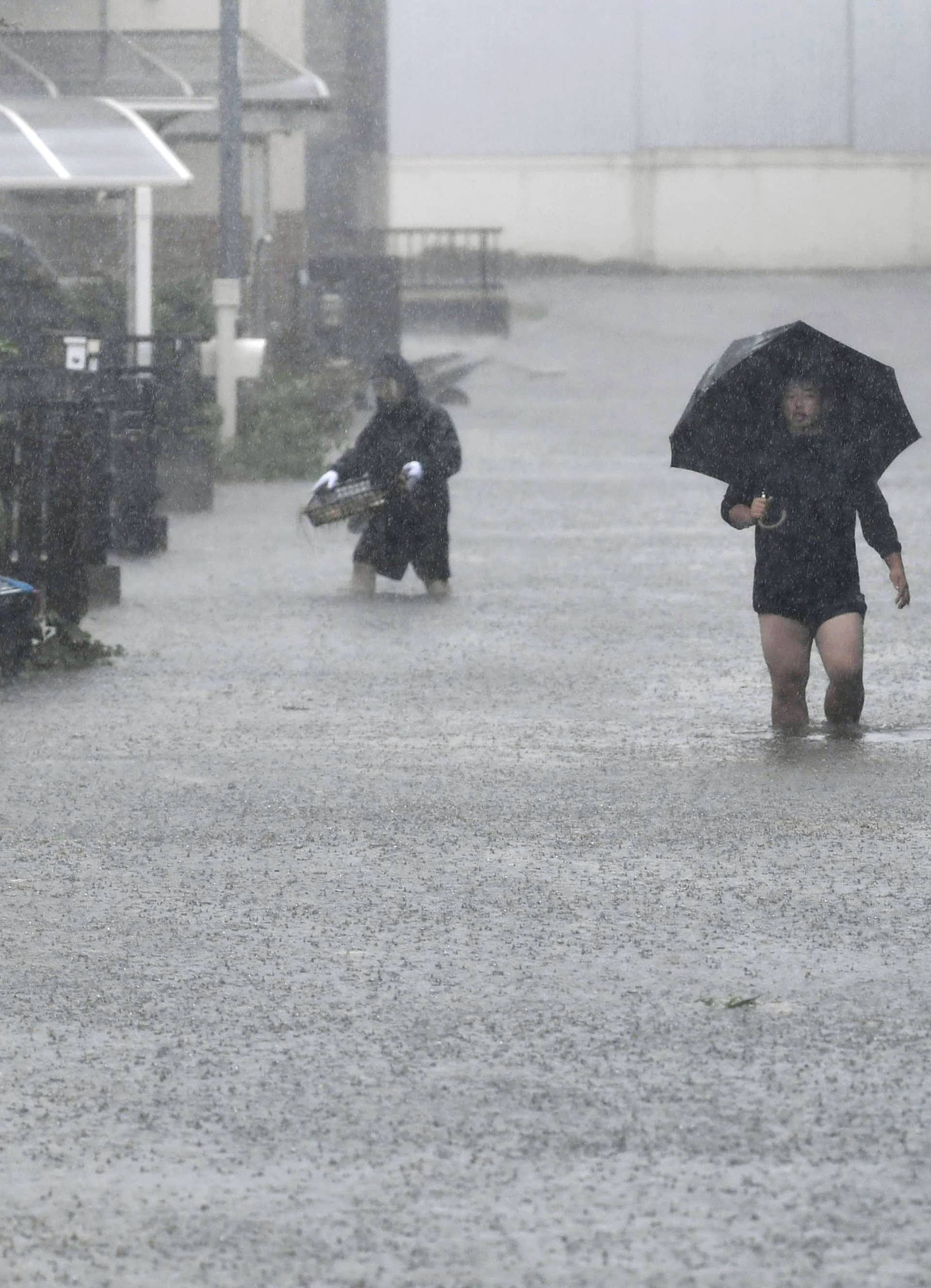 Roads are flooded due to heavy rains caused by Typhoon Hagibis in Shizuoka, Japan