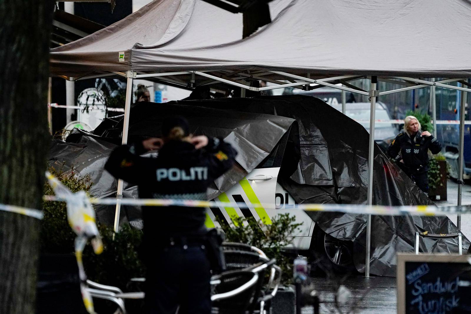 Police members stand at a site where shots were fired in Bislett area in Oslo