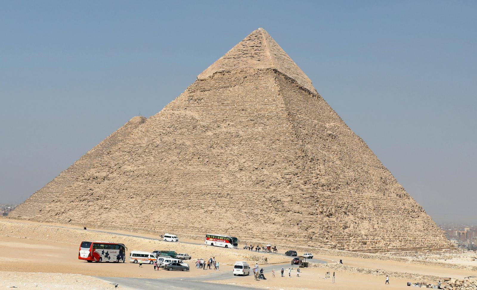Tourists visit the Giza pyramids area, on the outskirts of Cairo