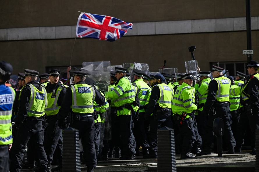 Anti-racism protesters gather to counter anti-immigration rally led by Tommy Robinson, in London