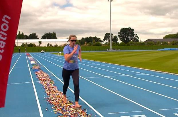 VIDEO: Woman breaks bizarre world record for fastest 100m run barefoot over LEGO