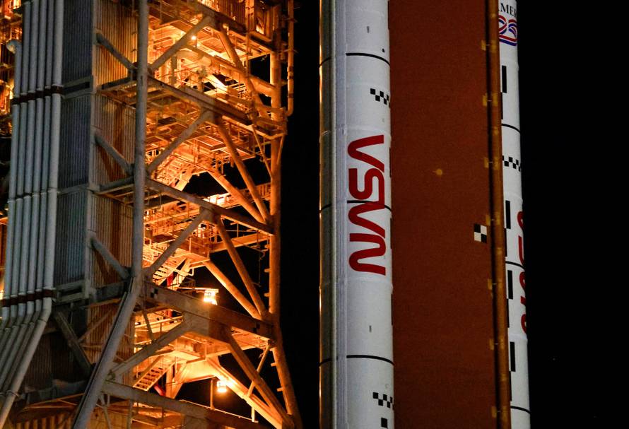 NASA's next-generation moon rocket, the Space Launch System (SLS) rocket with the Orion crew capsule, rolls again to Pad 39B for launch