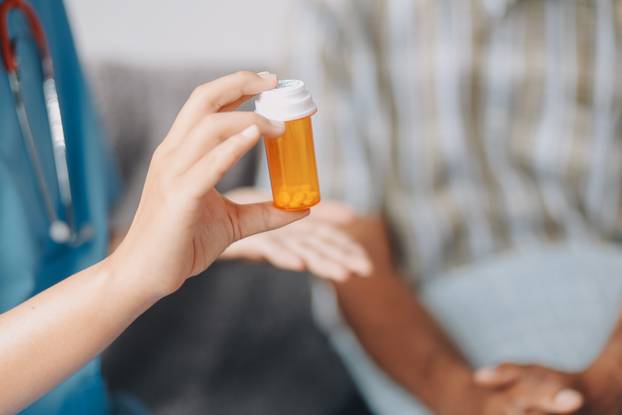 Female doctor discusses medication with patient