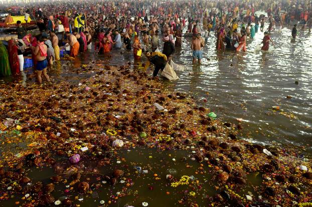Devotees take a dip at Sangam during "Maha Kumbh Mela" in Prayagraj