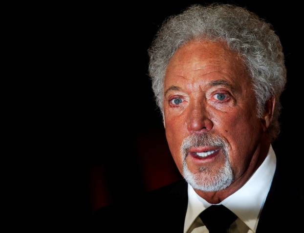 FILE PHOTO: Singer Tom Jones arrives for the British Academy of Film and Arts (BAFTA) awards ceremony at the Royal Opera House in London