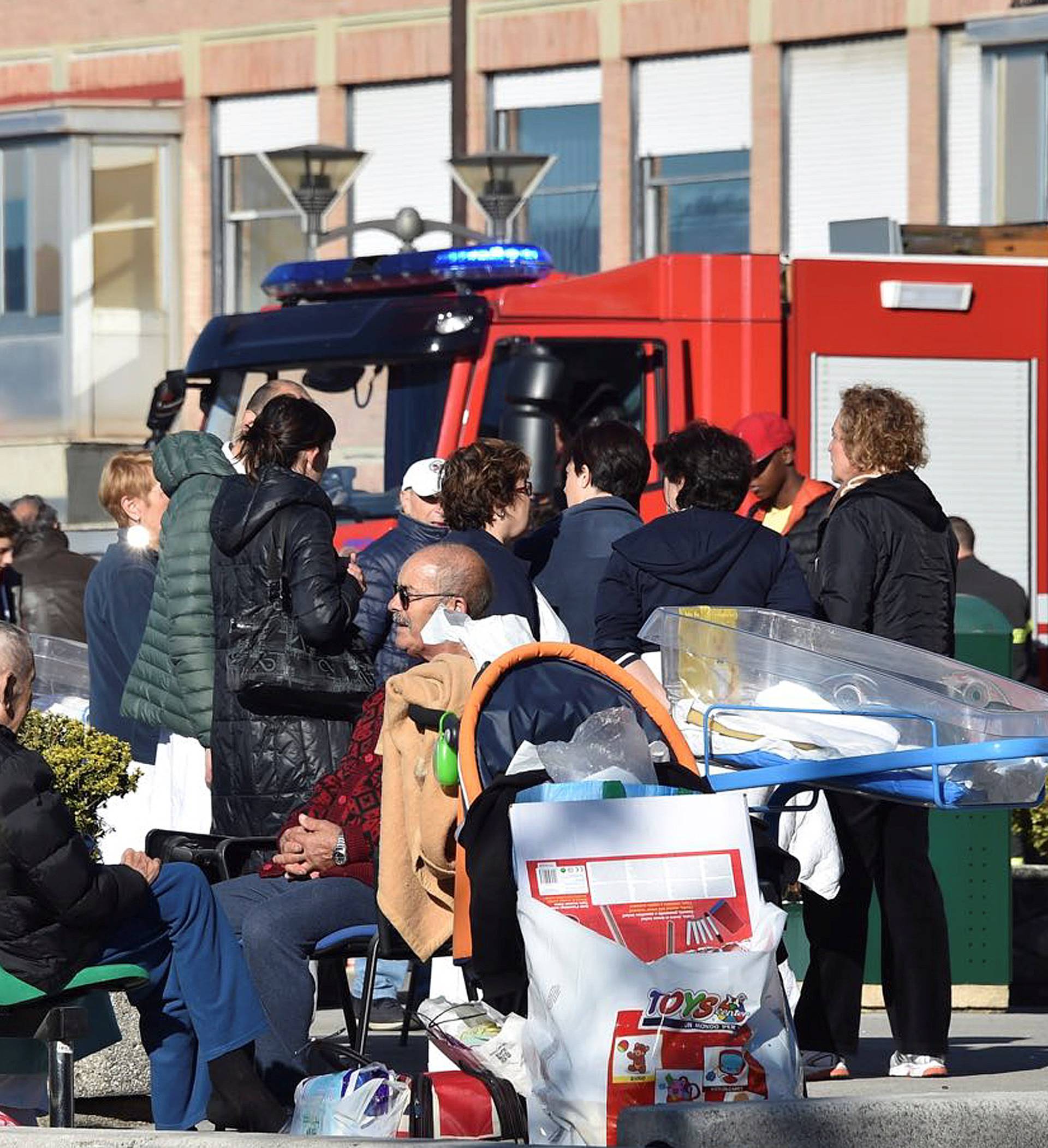 People are evacuated from an hospital following an earthquake in Rieti