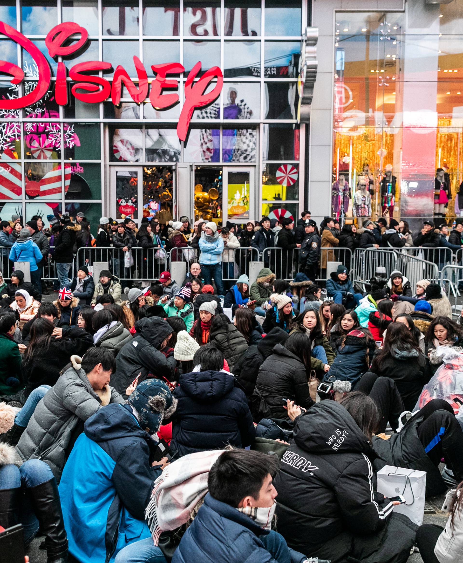 Revelers wait for theÂ NewÂ Year'sÂ EveÂ in Times Square inÂ the Manhattan