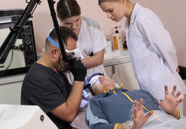Former Ukrainian service member, who was wounded at a front line, comes to a clinic to treat scars, in Lviv