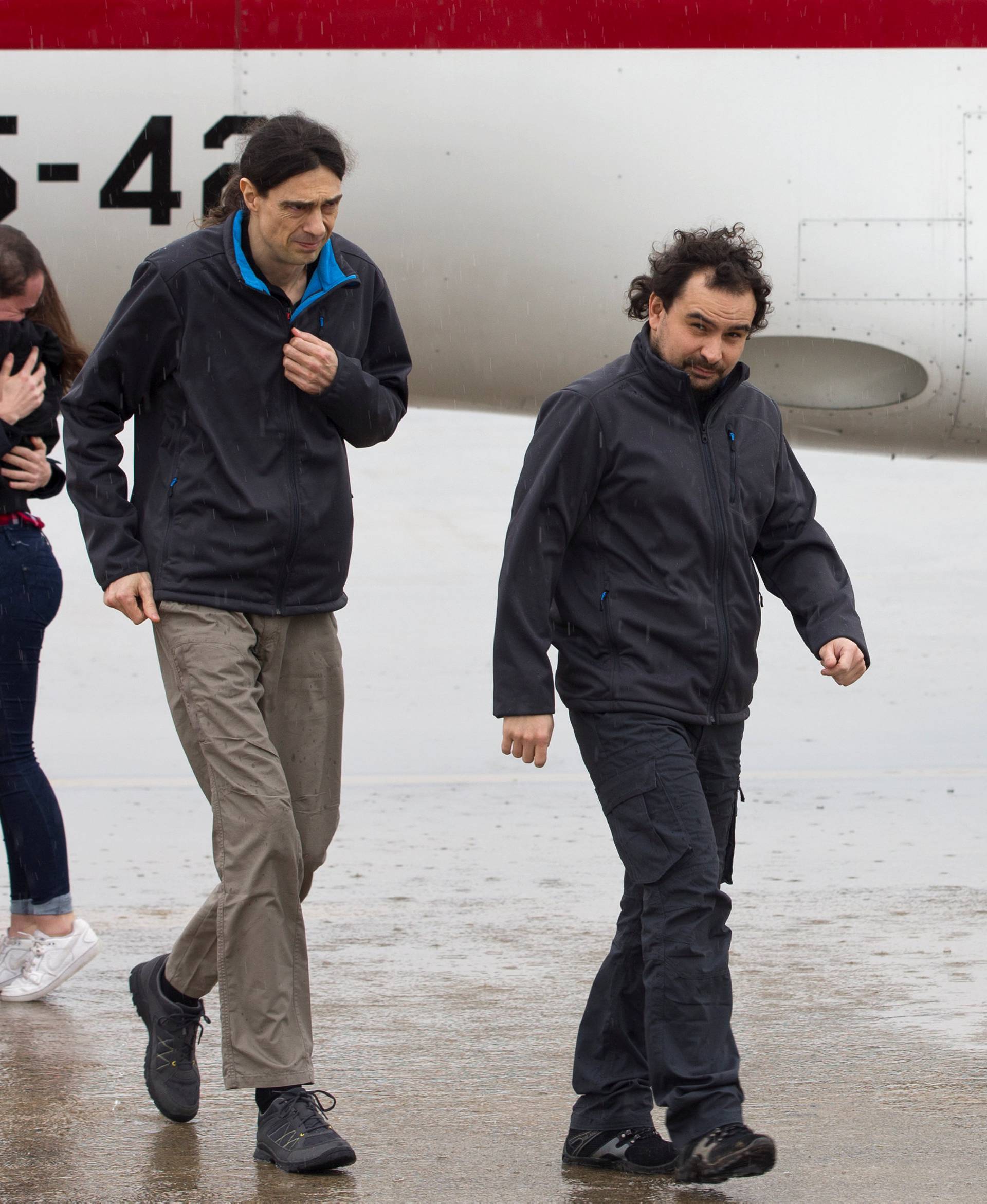 Pampliega, Lopez and Sastre, three Spanish freelance journalists who went missing in Syria last year and were believed to have been kidnapped, arrive at Torrejon's military airport, Spain