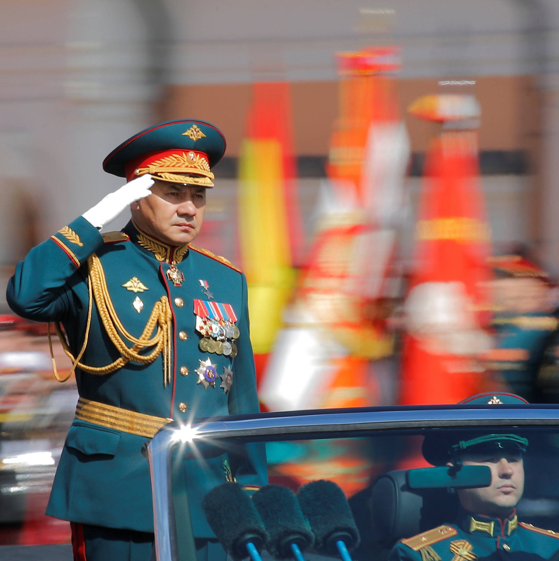 Russian Defence Minister Shoigu salutes as he takes part in the Victory Day parade at Red Square in Moscow