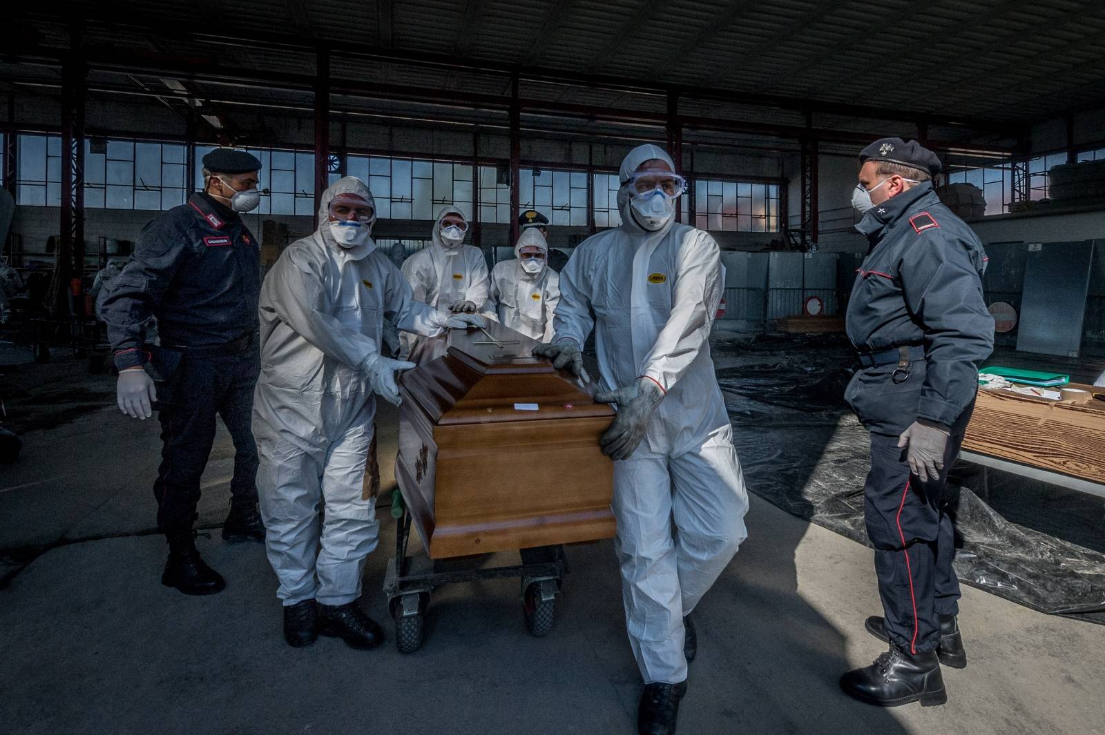 San Pietro bridge. Military and medical personnel of the Army together with the Carabinieri transport the coffins with the use of six trucks from a depot in Ponte San Pietro due to emergency COVID19 Coronavirus