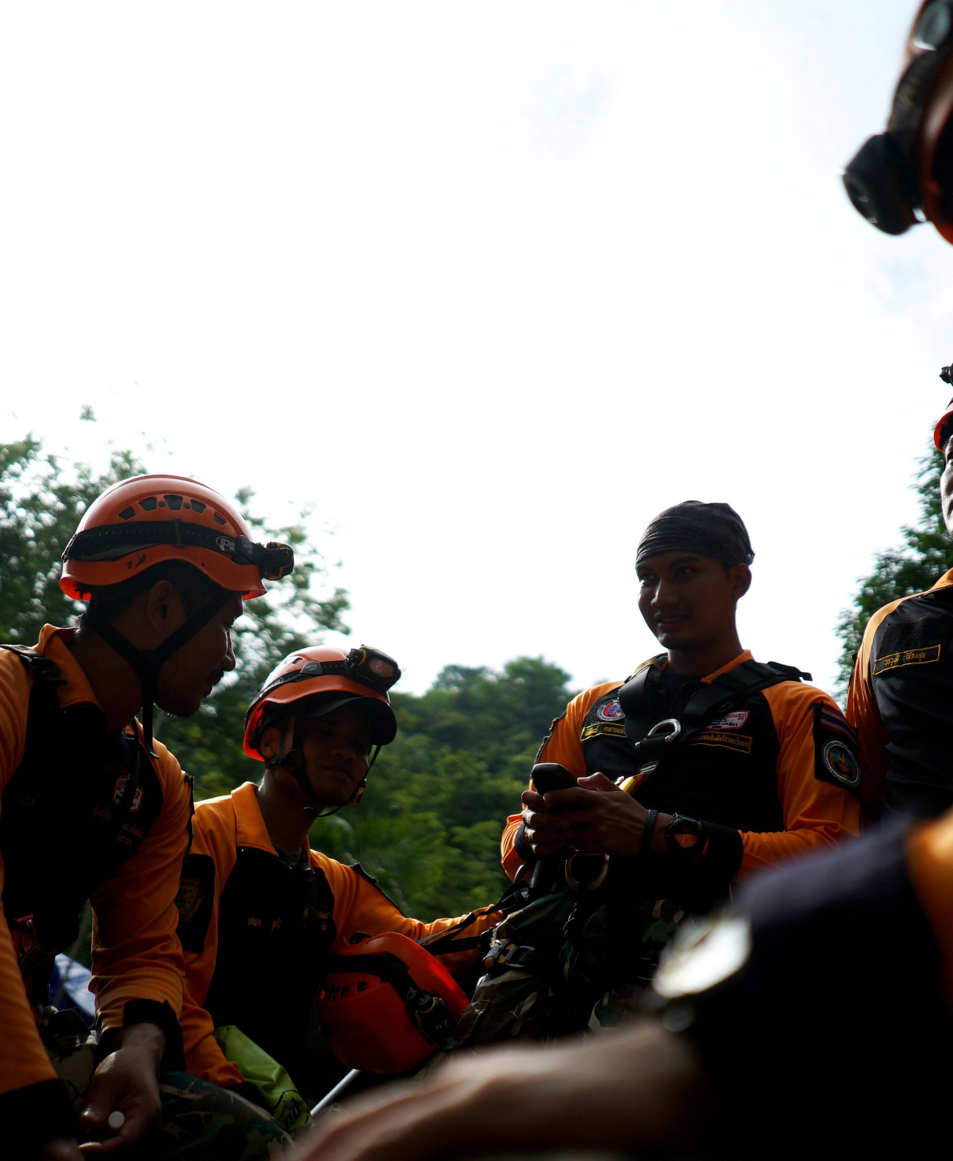 Rescue workers get ready to explore an area for shafts near the Tham Luang cave complex, where 12 boys and their soccer coach are trapped, in the northern province of Chiang Rai