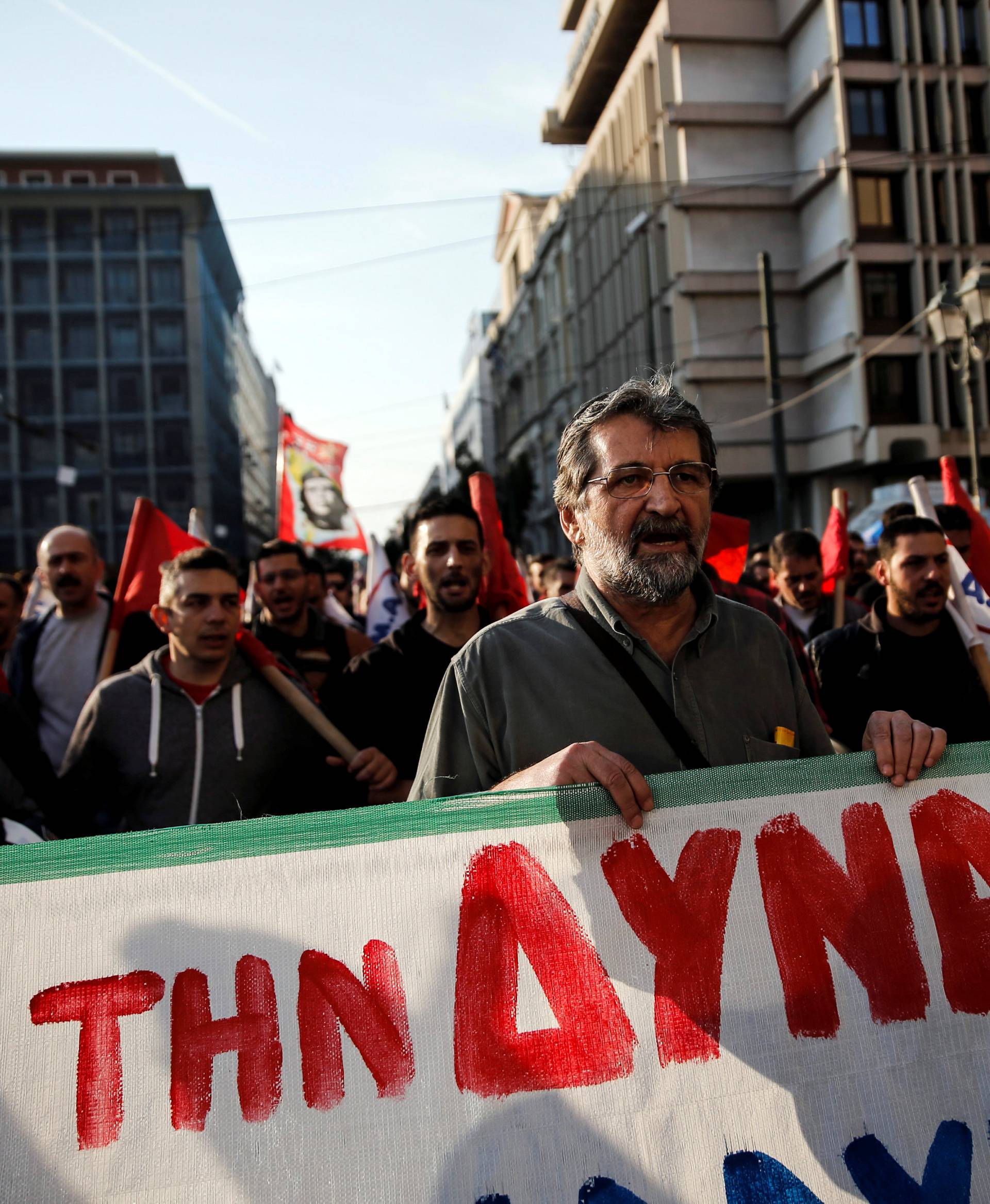 Members of the communist-affiliated PAME union shout slogans during a 48-hour general strike against tax and pension reforms in Athens
